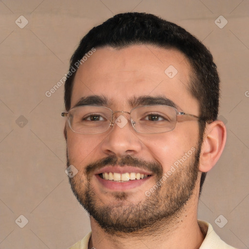 Joyful white young-adult male with short  black hair and brown eyes