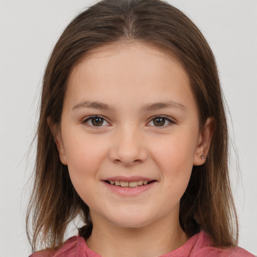 Joyful white child female with medium  brown hair and brown eyes