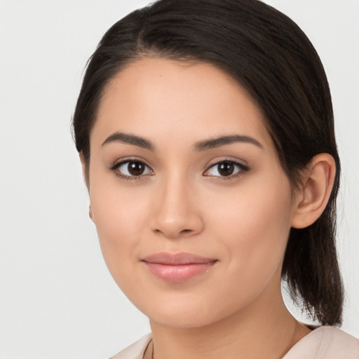 Joyful white young-adult female with medium  black hair and brown eyes