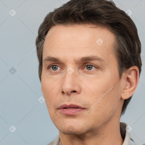 Neutral white adult male with short  brown hair and brown eyes