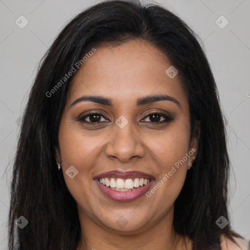 Joyful latino young-adult female with long  brown hair and brown eyes