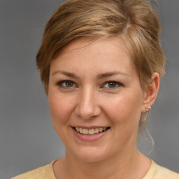 Joyful white young-adult female with medium  brown hair and brown eyes