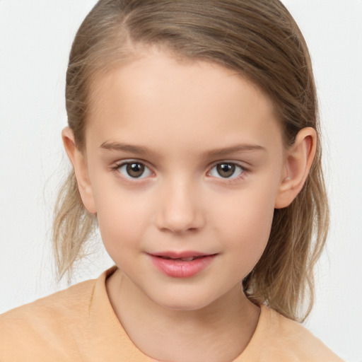 Joyful white child female with medium  brown hair and brown eyes