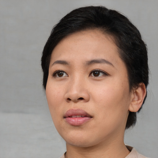 Neutral asian young-adult female with medium  black hair and brown eyes