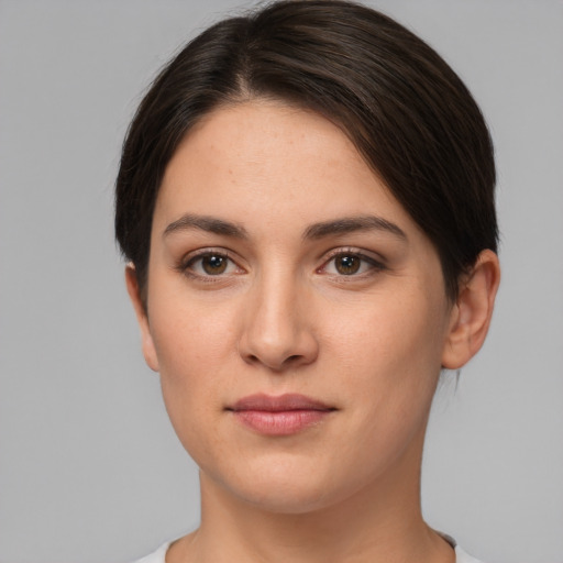 Joyful white young-adult female with short  brown hair and brown eyes