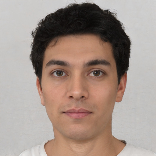 Neutral white young-adult male with short  black hair and brown eyes