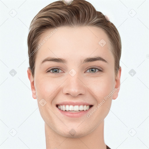 Joyful white young-adult female with short  brown hair and grey eyes