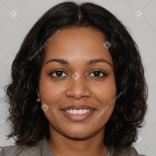 Joyful black young-adult female with medium  brown hair and brown eyes