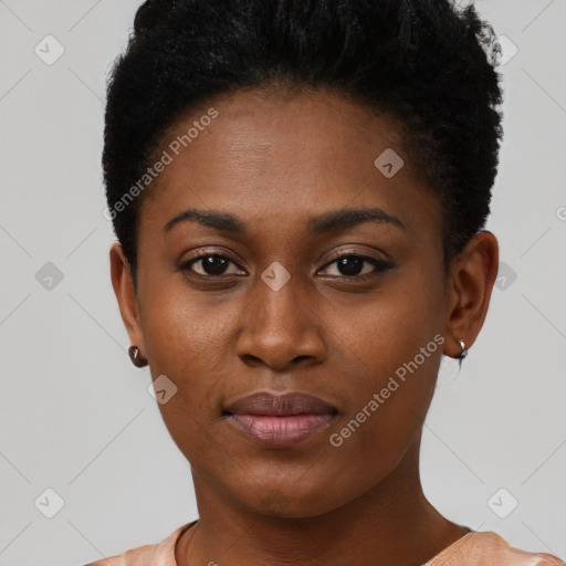 Joyful black young-adult female with short  brown hair and brown eyes