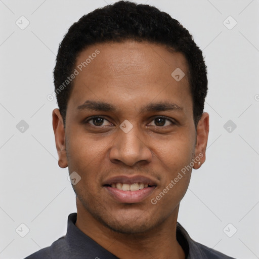 Joyful black young-adult male with short  black hair and brown eyes