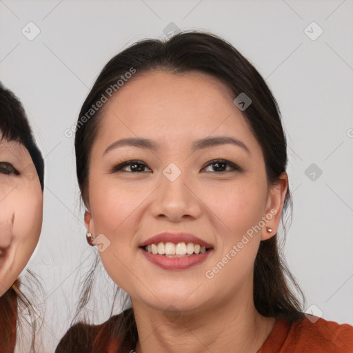 Joyful asian young-adult female with medium  black hair and brown eyes