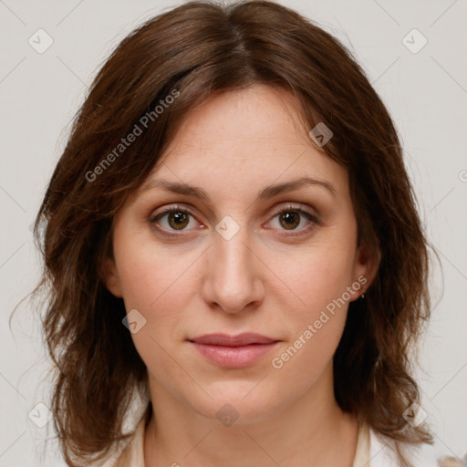 Joyful white young-adult female with medium  brown hair and green eyes