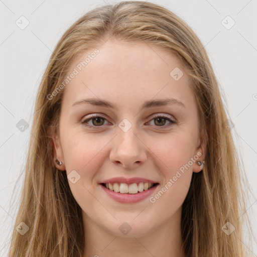 Joyful white young-adult female with long  brown hair and green eyes