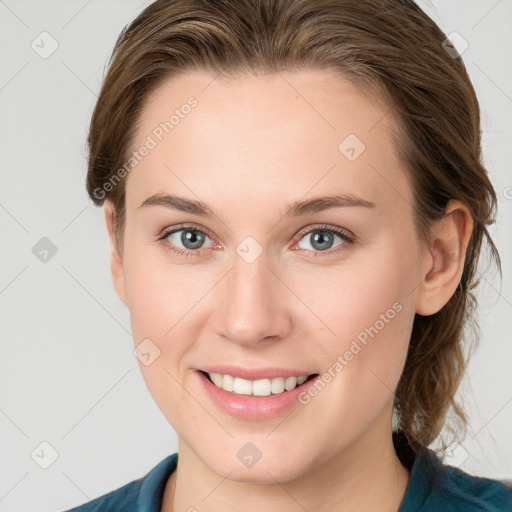 Joyful white young-adult female with medium  brown hair and blue eyes