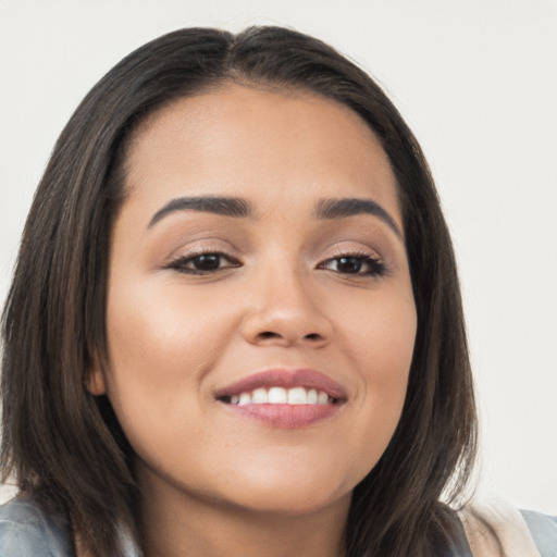 Joyful asian young-adult female with long  brown hair and brown eyes