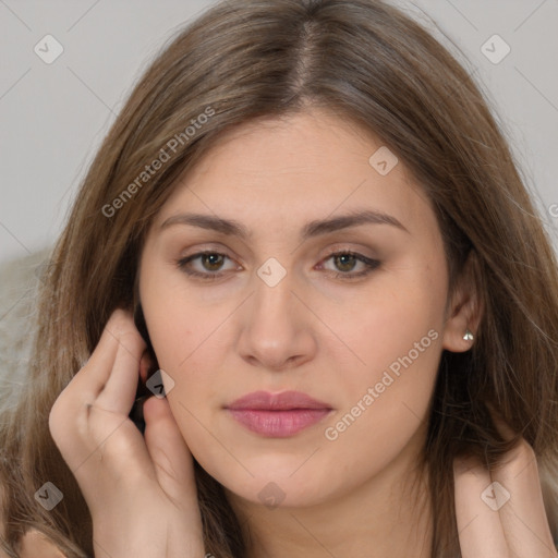 Joyful white young-adult female with long  brown hair and brown eyes