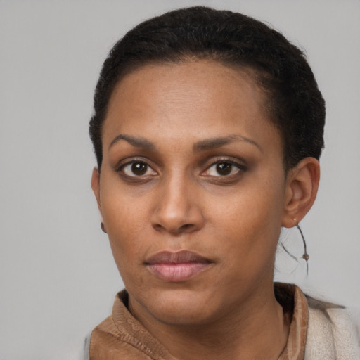 Neutral black young-adult female with short  brown hair and brown eyes