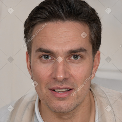 Joyful white adult male with short  brown hair and brown eyes