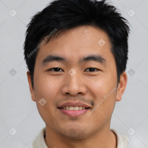 Joyful asian young-adult male with short  black hair and brown eyes