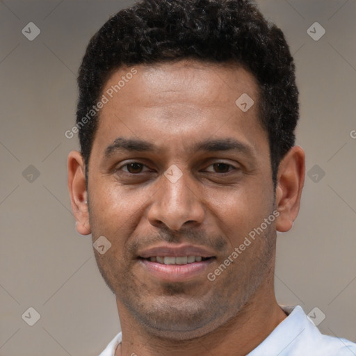 Joyful latino young-adult male with short  brown hair and brown eyes