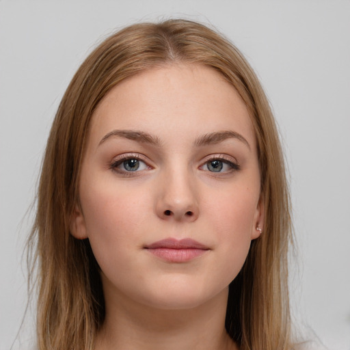 Neutral white young-adult female with long  brown hair and brown eyes