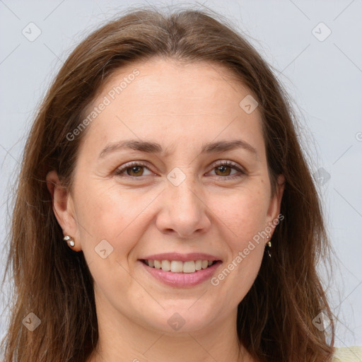 Joyful white adult female with long  brown hair and brown eyes