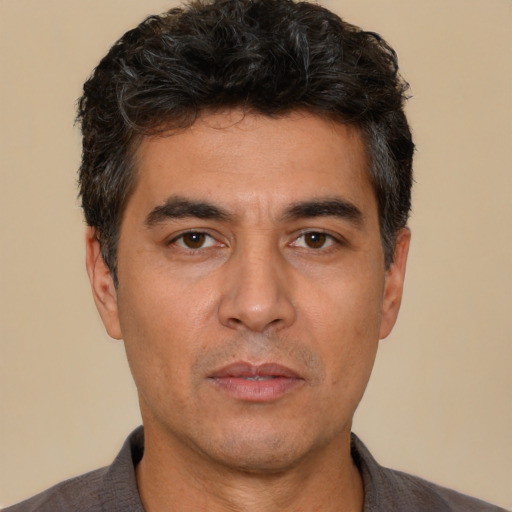 Neutral white adult male with short  black hair and brown eyes