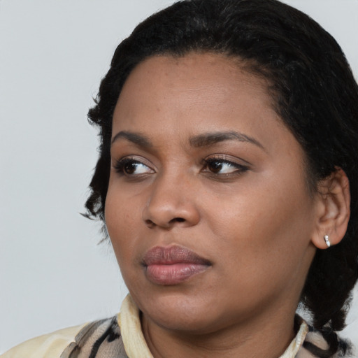 Neutral latino young-adult female with medium  black hair and brown eyes