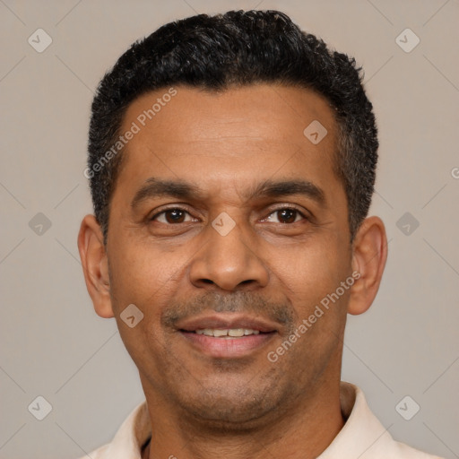 Joyful latino adult male with short  black hair and brown eyes