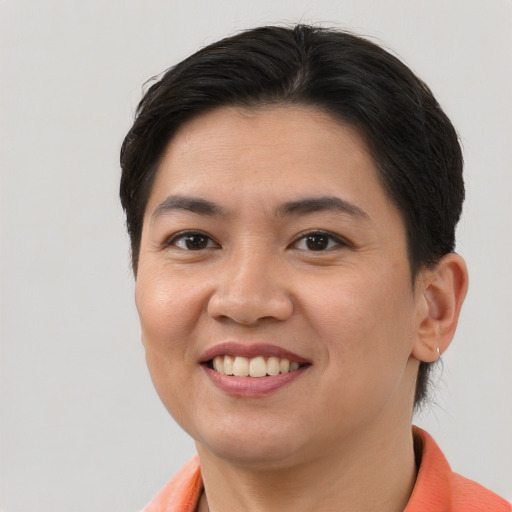 Joyful asian young-adult female with short  brown hair and brown eyes