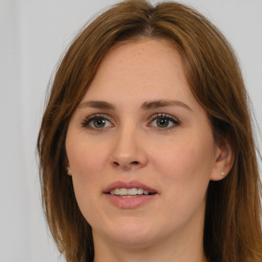 Joyful white young-adult female with long  brown hair and brown eyes