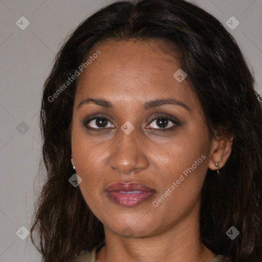 Joyful black adult female with medium  brown hair and brown eyes