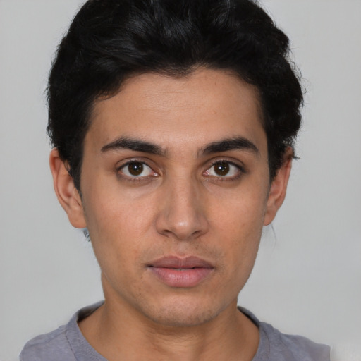 Neutral latino young-adult male with short  black hair and brown eyes