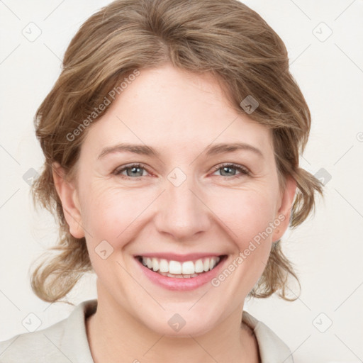 Joyful white young-adult female with medium  brown hair and blue eyes