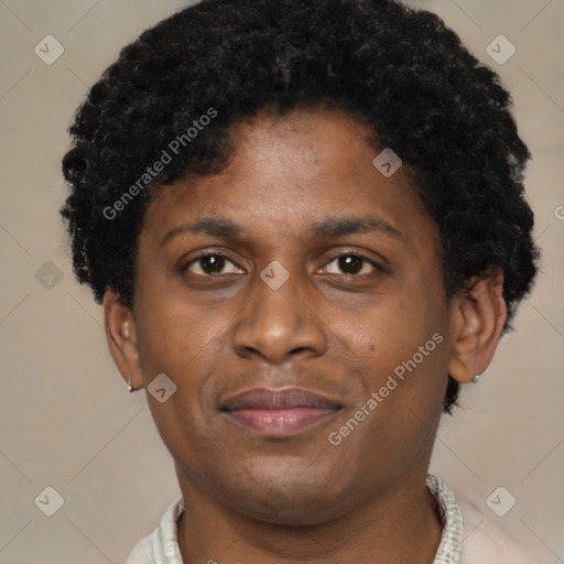 Joyful black adult male with short  brown hair and brown eyes