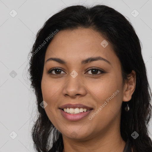 Joyful latino young-adult female with long  brown hair and brown eyes