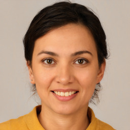 Joyful white young-adult female with medium  brown hair and brown eyes