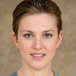 Joyful white young-adult female with short  brown hair and grey eyes