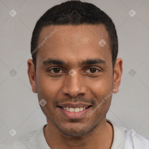 Joyful black young-adult male with short  black hair and brown eyes