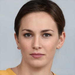 Neutral white young-adult female with short  brown hair and brown eyes