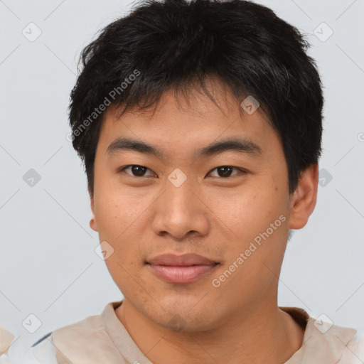 Joyful asian young-adult male with short  brown hair and brown eyes