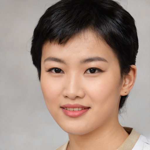 Joyful asian young-adult female with medium  black hair and brown eyes