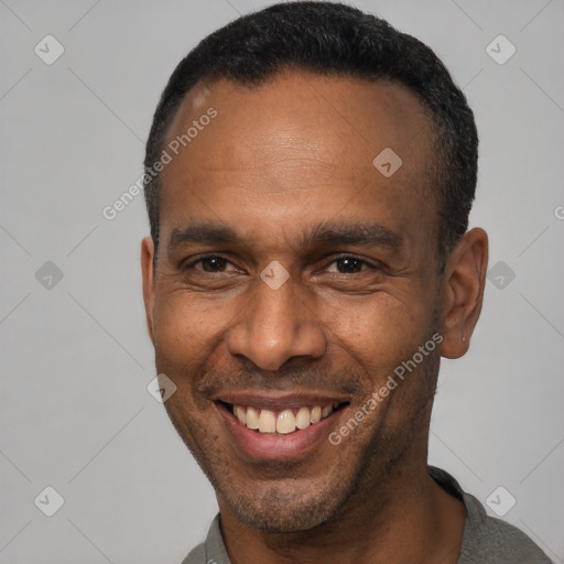 Joyful latino adult male with short  black hair and brown eyes