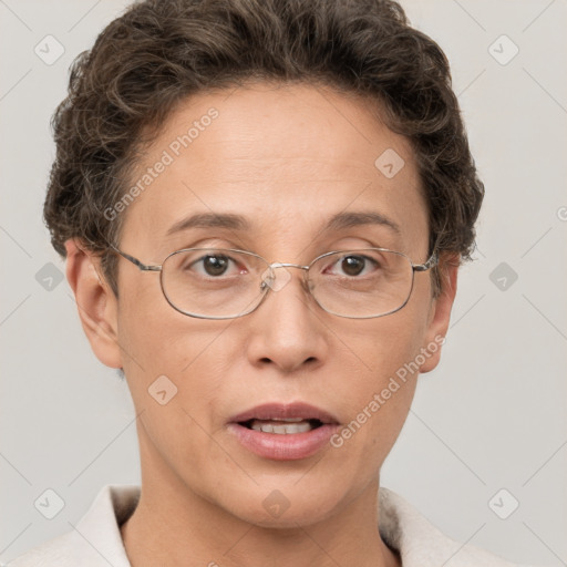 Joyful white adult female with short  brown hair and grey eyes