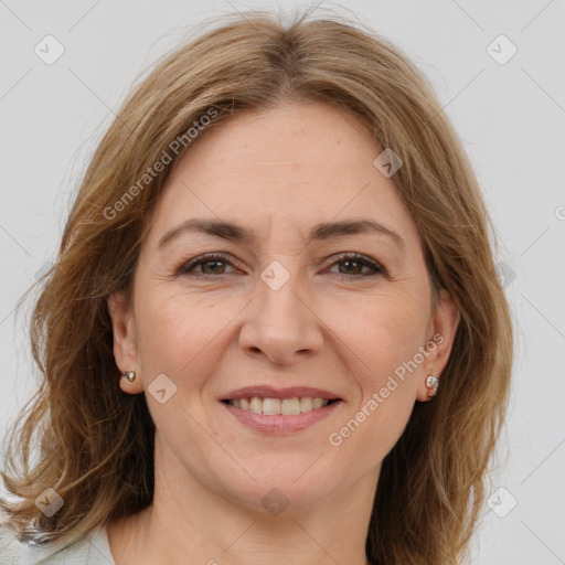 Joyful white adult female with medium  brown hair and grey eyes