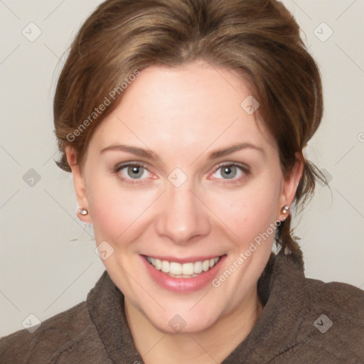 Joyful white young-adult female with medium  brown hair and green eyes