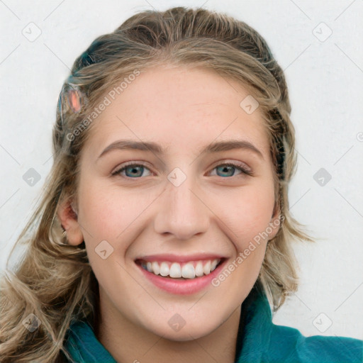 Joyful white young-adult female with long  brown hair and blue eyes