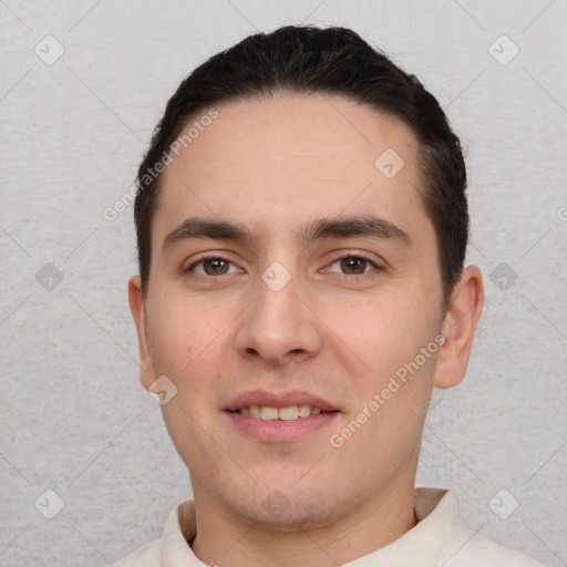 Joyful white young-adult male with short  brown hair and brown eyes