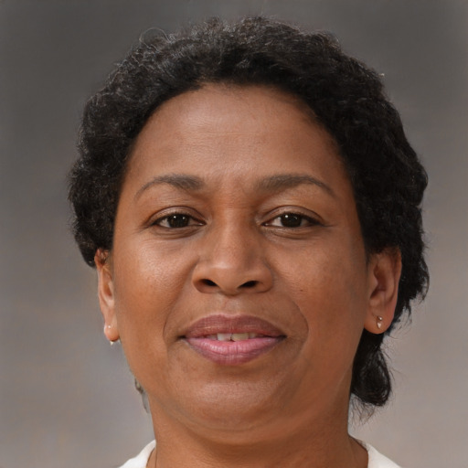 Joyful black adult female with short  brown hair and brown eyes
