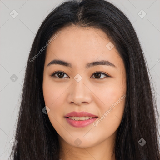 Joyful asian young-adult female with long  brown hair and brown eyes